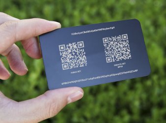 A ColdCoins card with a bitcoin address and QR code public and private key.